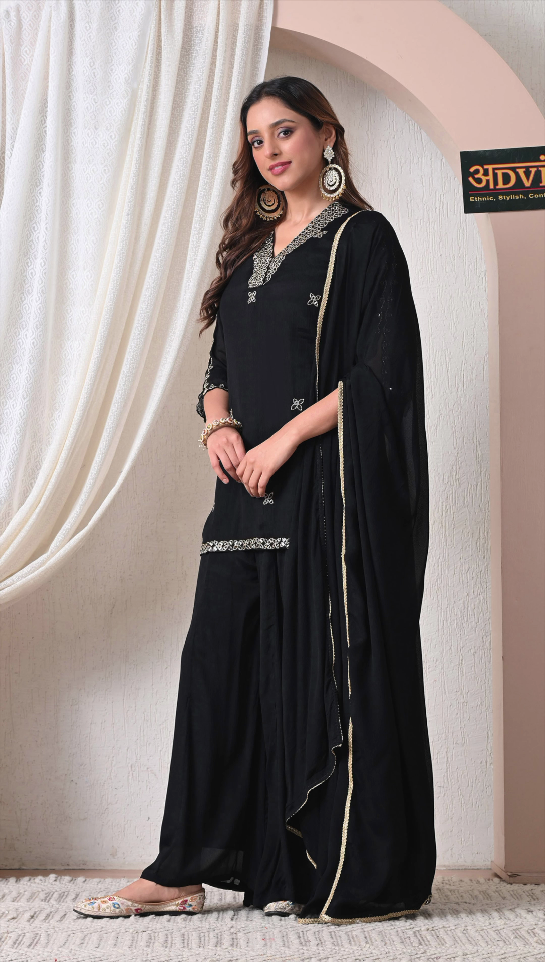 Full look of black party wear sharara set for women