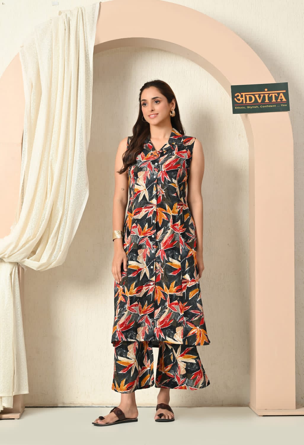 Woman wearing floral print A-line kurta set with matching bottoms