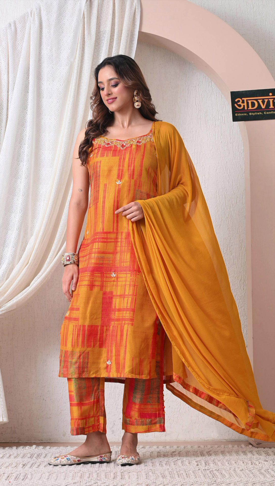 Full look of mustard orange muslin silk kurti set