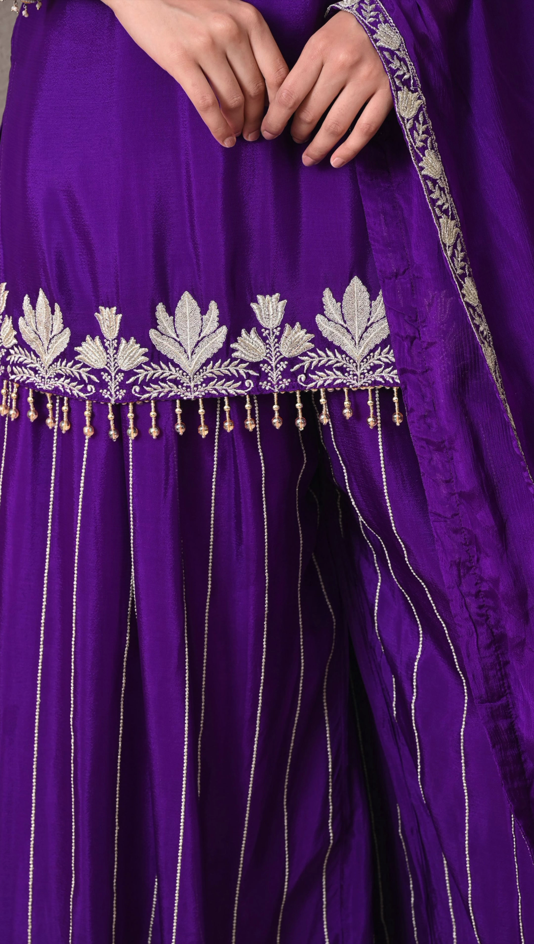 Detail view of embroidery work on purple chinon sharara pants