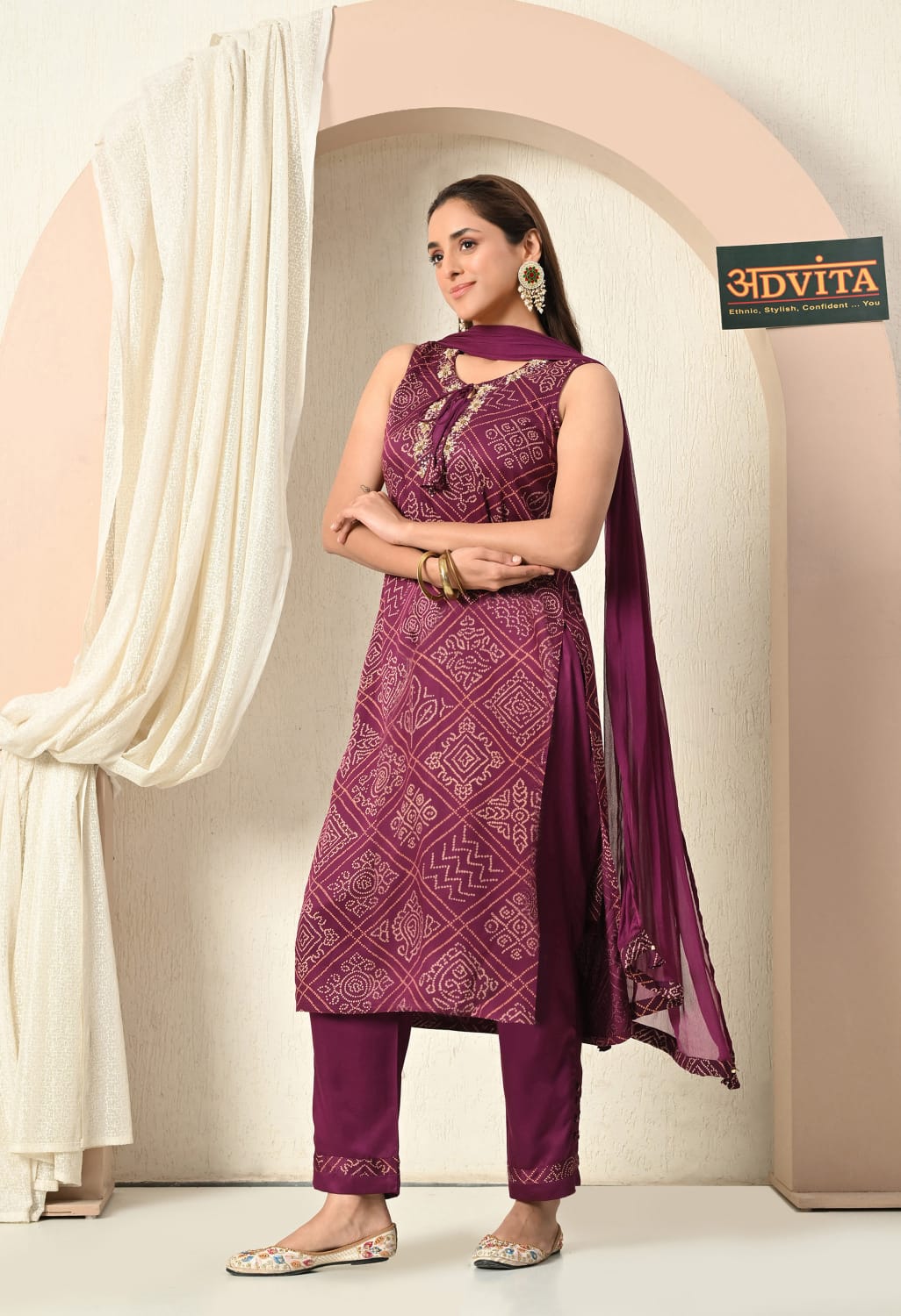 Woman wearing wine bandhani printed suit with dupatta
