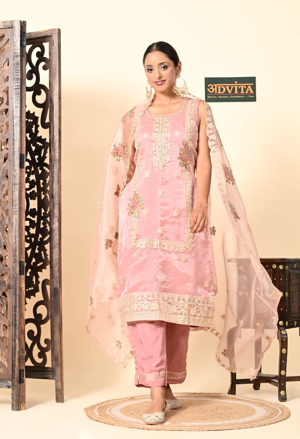 Woman wearing gajri pink party wear 3 piece suit with dupatta