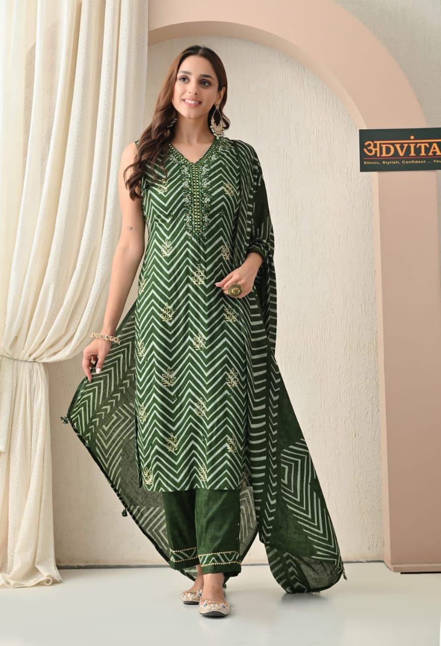 Woman wearing green cotton kurti pant dupatta set