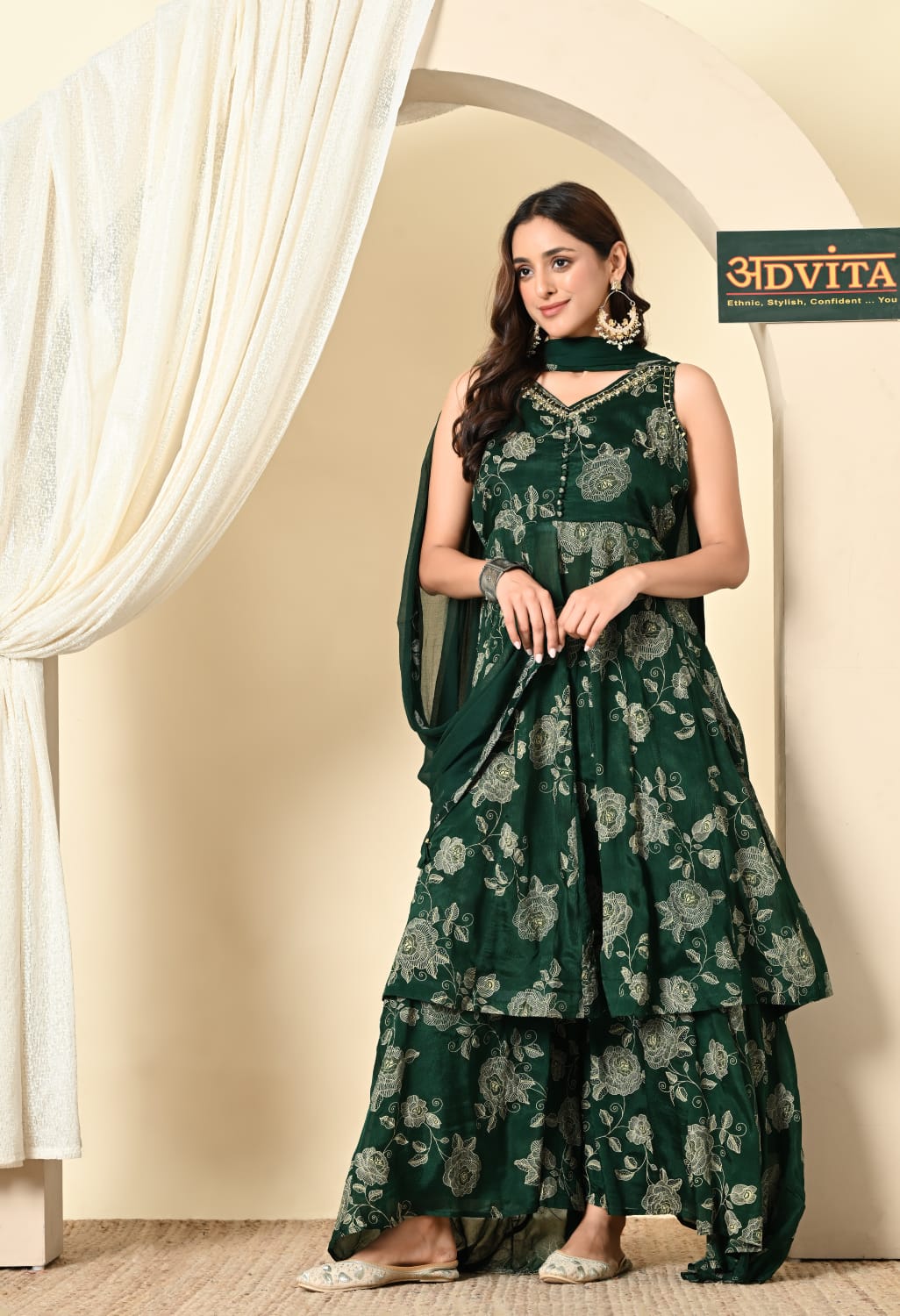 Woman wearing green floral divider suit with dupatta