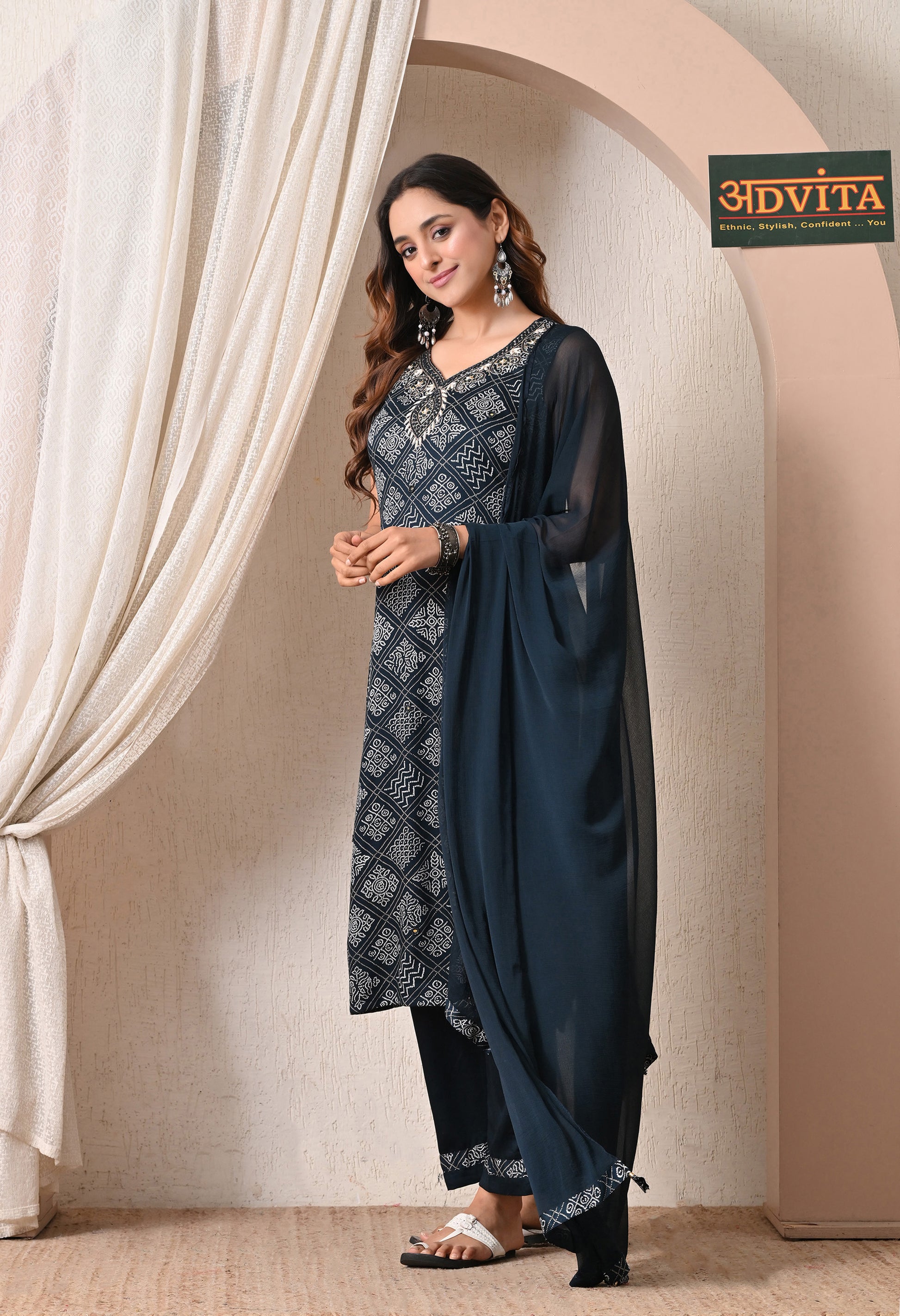 Side pose of navy blue printed ethnic 3 piece suit set