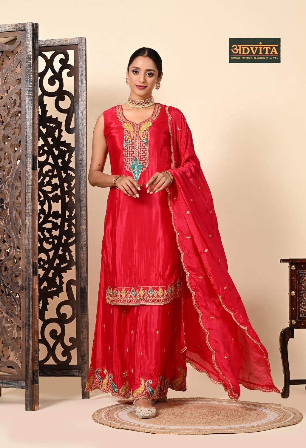 Woman wearing elegant red party wear suit with matching dupatta