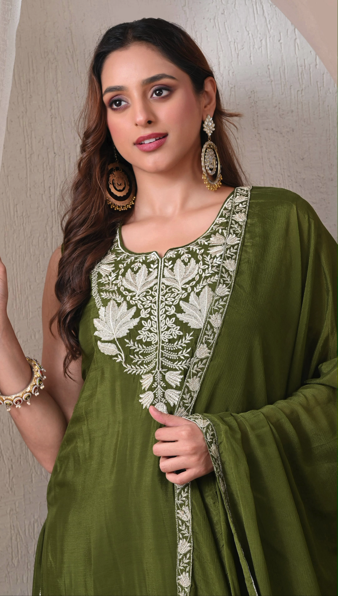 Closeup embroidery detailing on olive green chinon sharara set