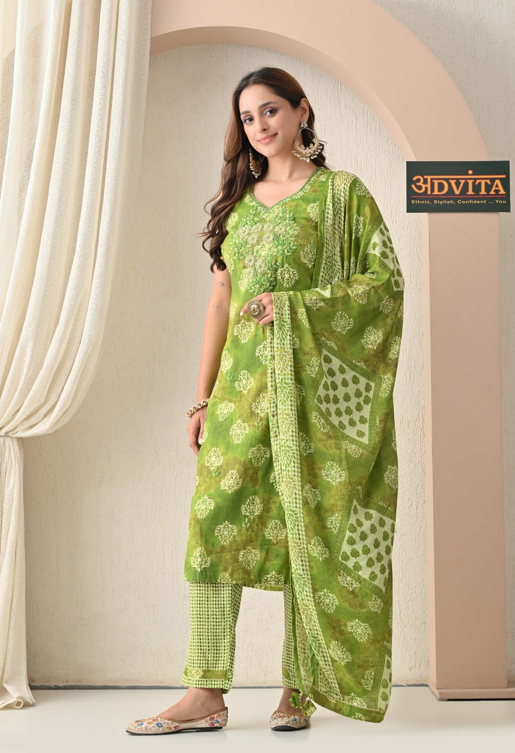 Woman wearing green rayon cotton daily wear suit with dupatta