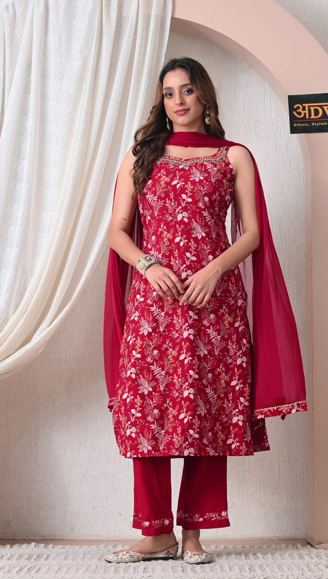 Woman wearing maroon floral rayon cotton suit set with dupatta