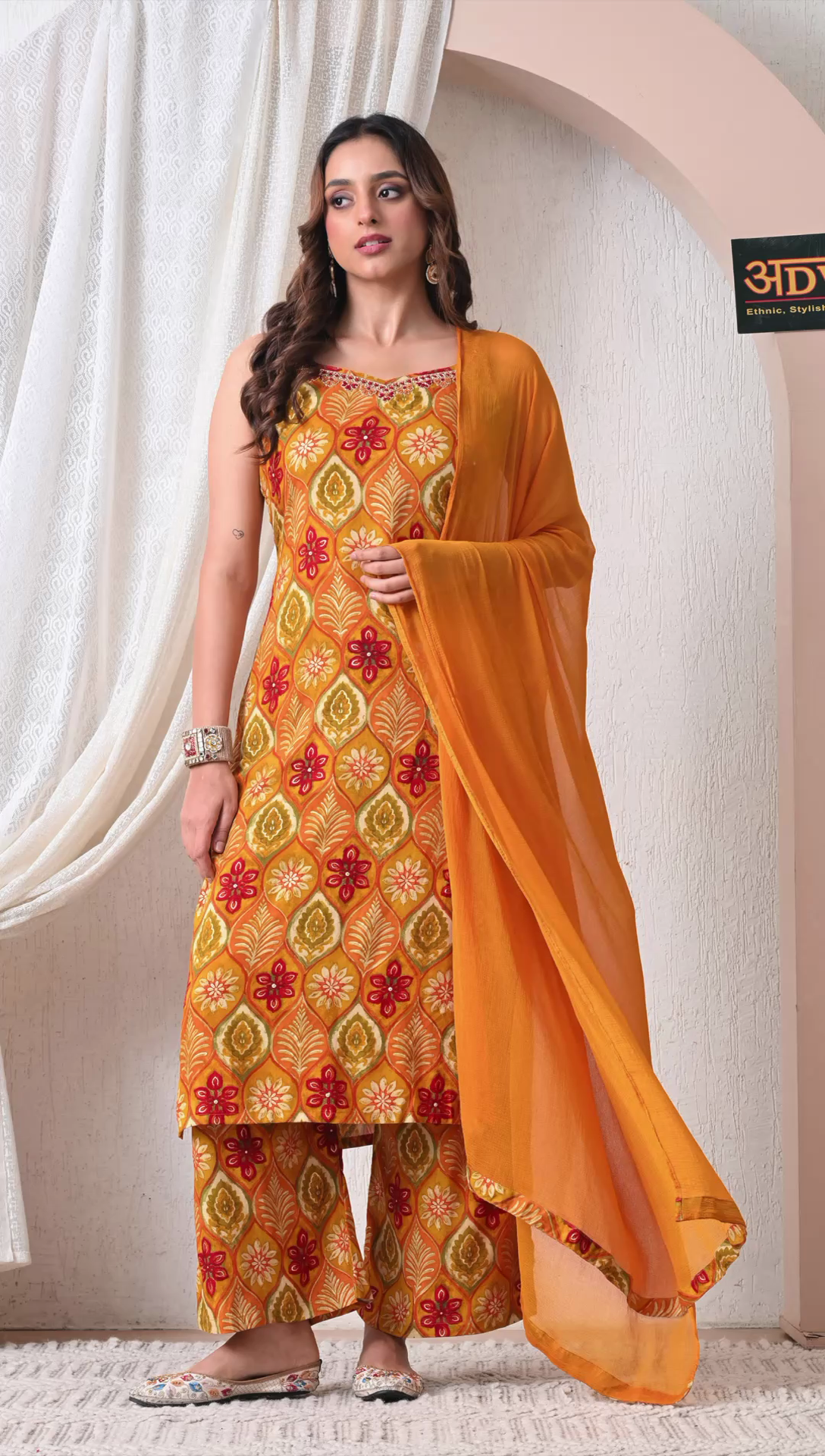 Woman wearing mustard yellow printed rayon cotton suit set with dupatta