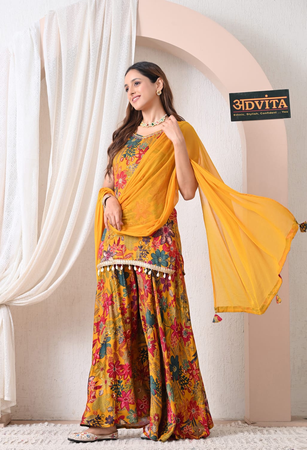 Full look of mustard yellow party wear sharara suit