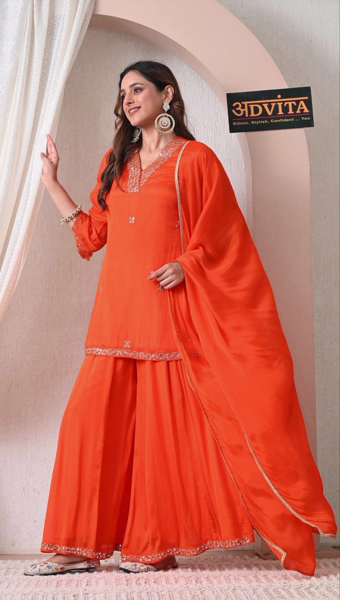 Full look of orange flared sharara suit for women