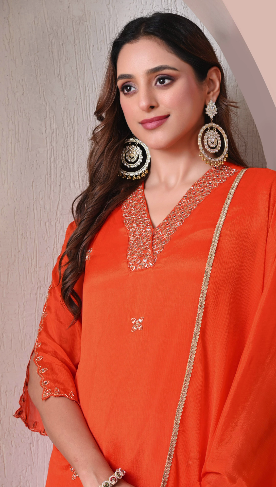 Closeup detail of orange party wear sharara suit