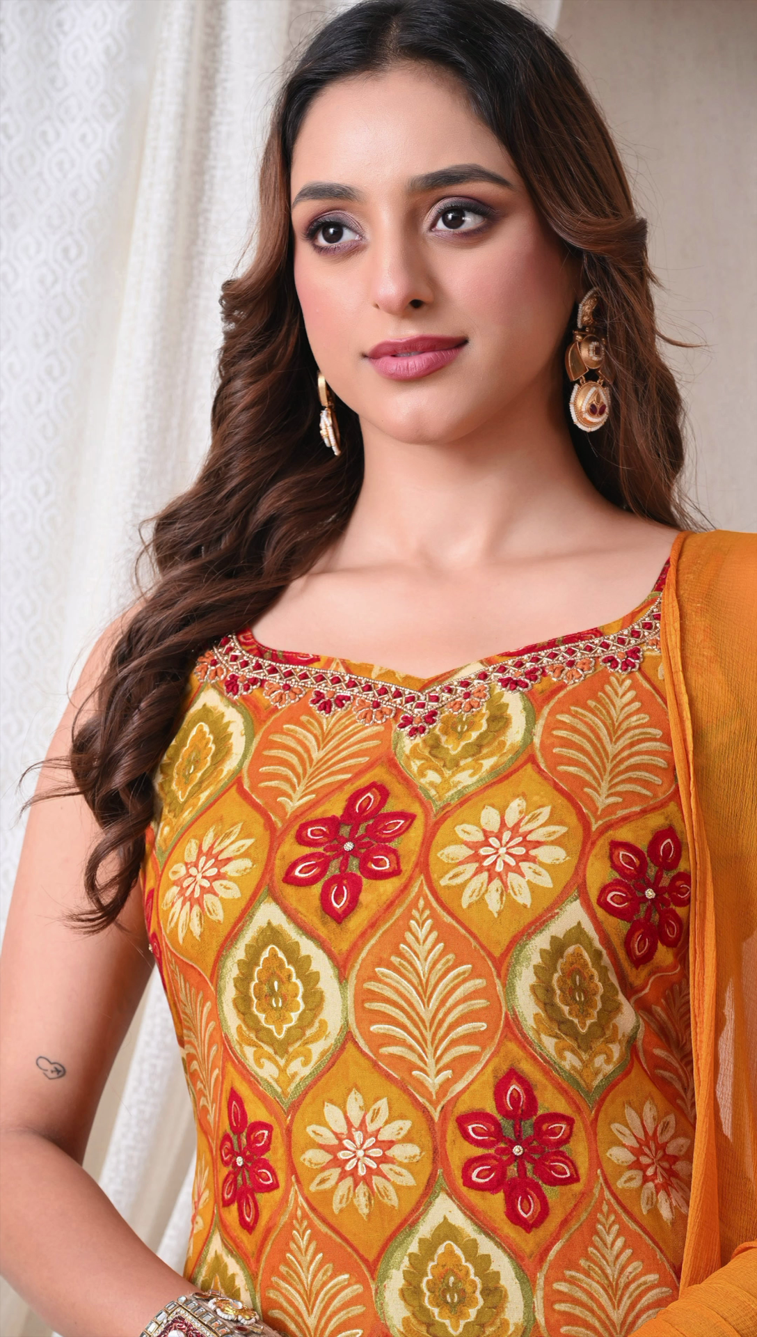 Closeup detail of mustard yellow printed rayon cotton suit