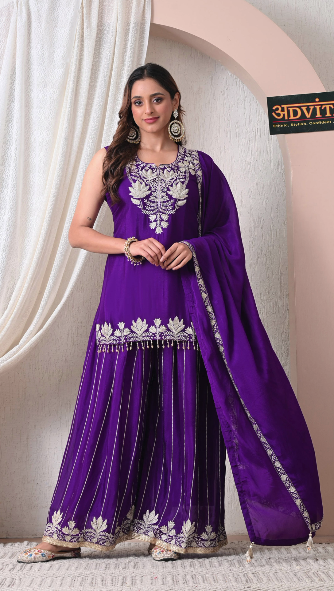 Woman wearing royal purple chinon embroidered sharara set with dupatta