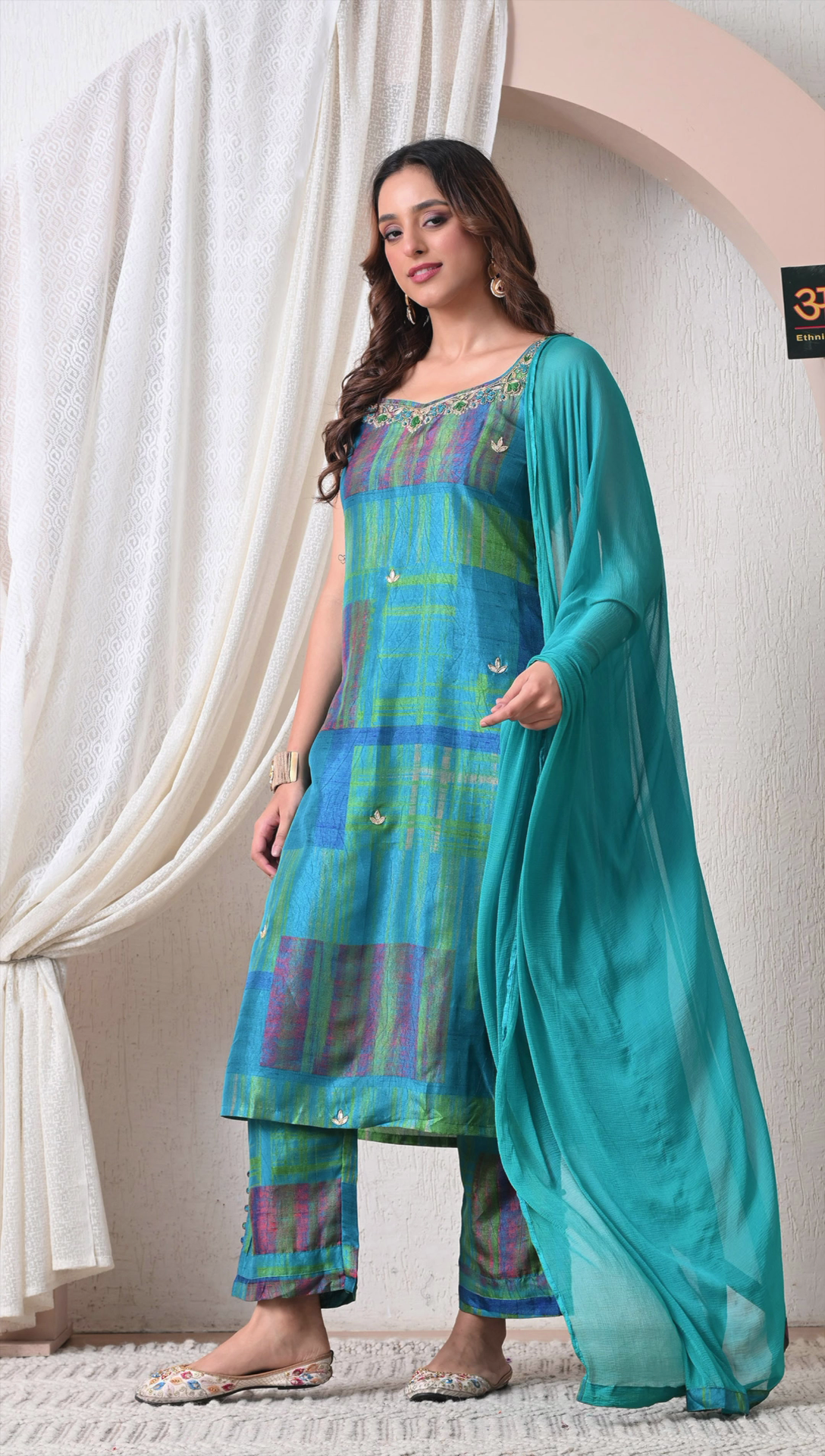 Side view of teal blue muslin silk kurti set for women